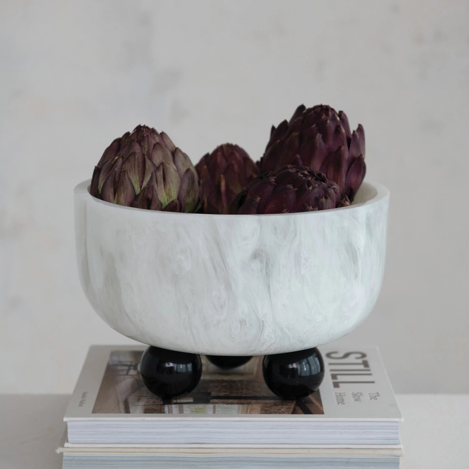 White and Black Marbled Resin Bowl with Ball Feet